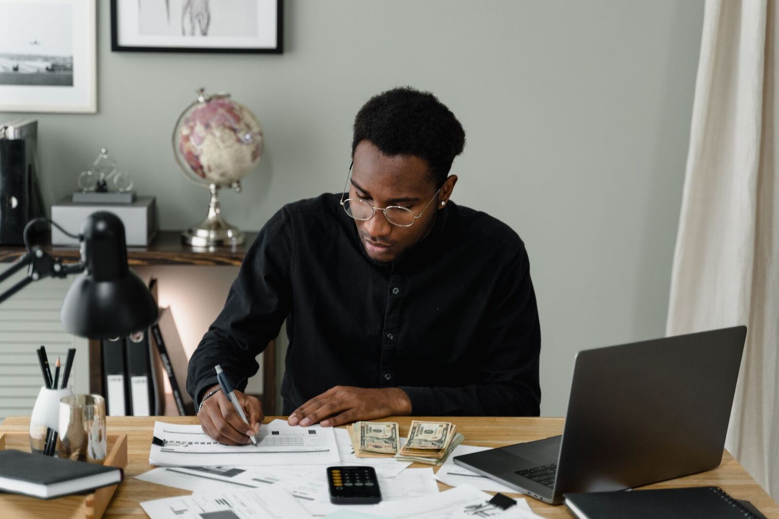 Professional working through documents at a desk